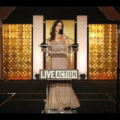 Lila Rose speaking at a podium