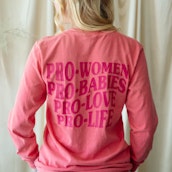 A young woman wearing Live Action merchandise