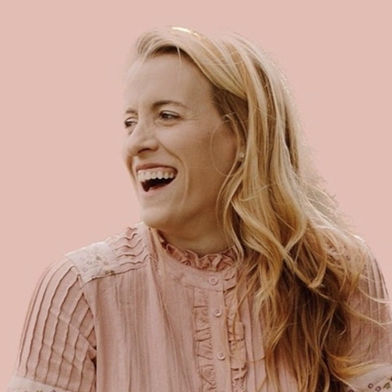 Emily Wilson headshot on pink background