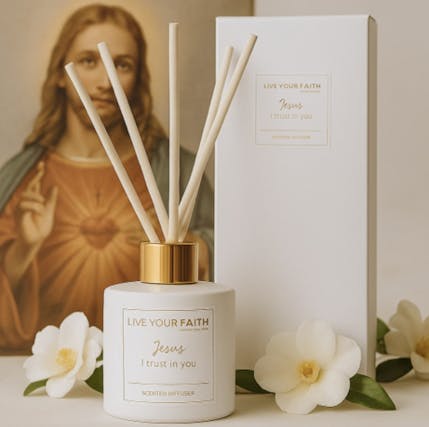 A photo of jesus and a jar of perfume