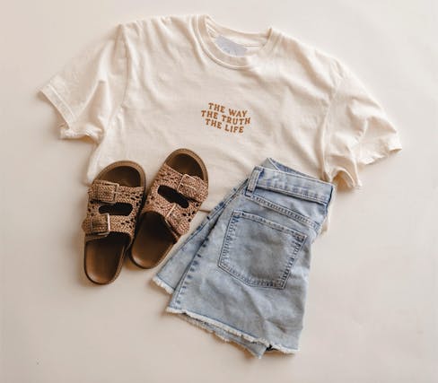 White tshirt, brown shoes, denim shorts
