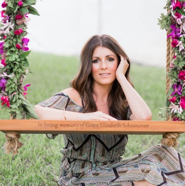 Stephanie Schoonover with the swing they dedicated in memory of Grace. Photo by Jenni Dawson of J. Noel Photography. Stephanie Schoonover with the swing they dedicated in memory of Grace. Photo by Jenni Dawson of J. Noel Photography.