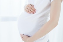 Pregnant woman holding her belly Pregnant woman holding her belly