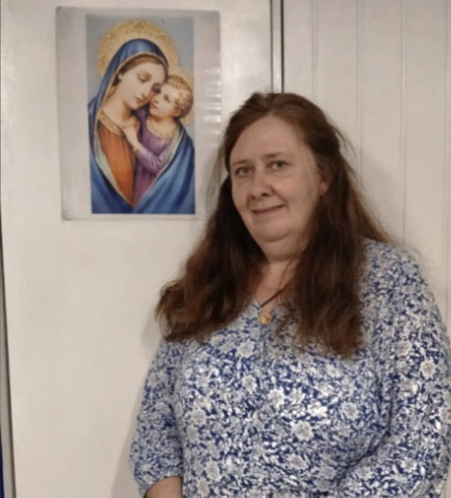 (Photo of Clare  , flanked by the image of the Blessed Virgin Mary of Good Counsel on her right at the GCN office in London. Photo taken by Angeline Tan.) UK pro-life organization has provided pregnant women with vital support for nearly 30 years image