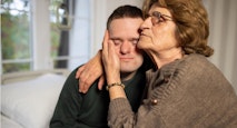 Mother Comforts Special Needs Son