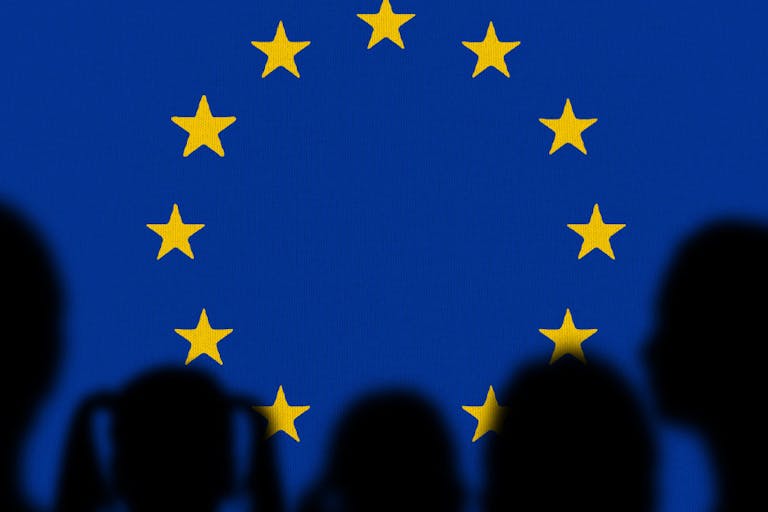 Family looking European Union Flag. Silhouette family with European Union Flag