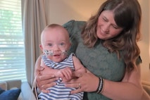 Preemie Nash Keen held by his mother.