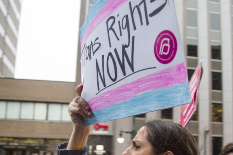 PORTLAND, ME - MARCH 1: Lindsay Ware carries a sign supporting transgender rights while walking with a group from Planned Parenthood on Congress Street before a rally at city hall. (Staff photo by Derek Davis/Portland Portland Press Herald via Getty Images) Rally for transgender rights