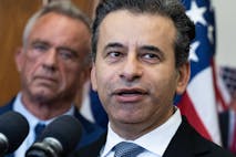 Photo: Tom Williams/Getty Images Dr. Marty Makary speaks as Robert F. Kennedy Jr is in the background