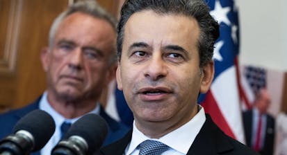 Dr. Marty Makary speaks as Robert F. Kennedy Jr is in the background