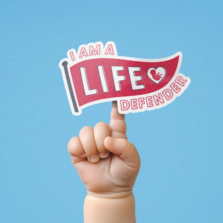 A baby hand with index finger pointing up