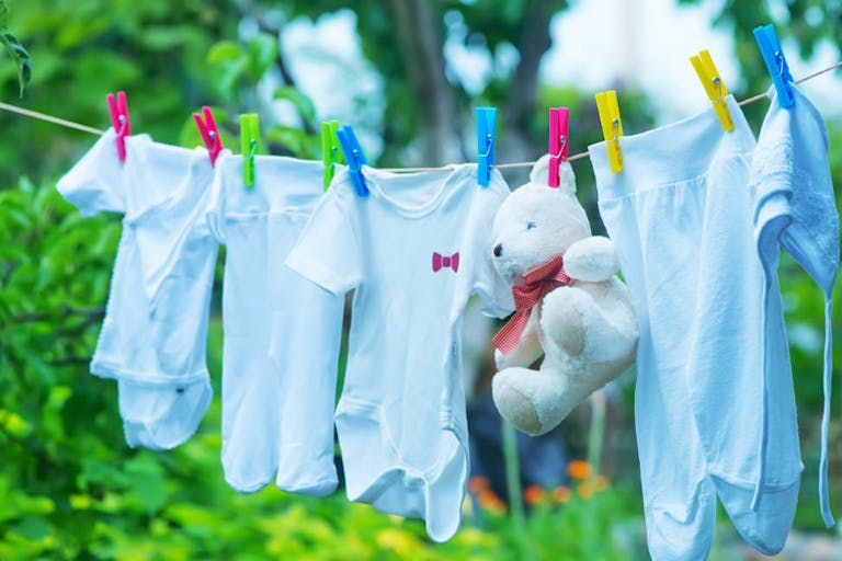 baby clothes, clear baby linnen in garden baby clothes