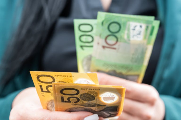 woman count new 50 100 australian currency on a city street. AUD aus Saving concept woman count new 50 100 australian currency on a city street. AUD Saving concept
