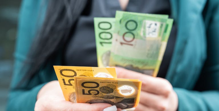 woman count new 50 100 australian currency on a city street. AUD Saving concept