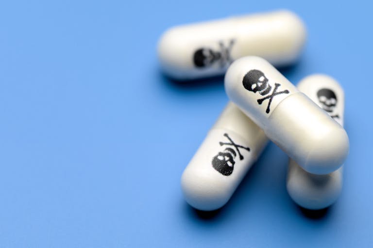 Poison pills with skull and crossbones