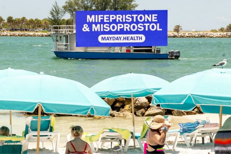 Photo: Mayday Health Instagram photo of Mayday Health advertisement for abortion pill on boat