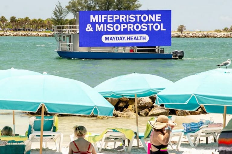 Photo: Mayday Health Instagram photo of Mayday Health advertisement for abortion pill on boat