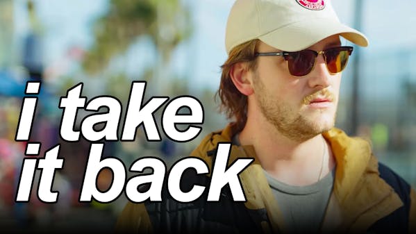 white man in sunglasses and ball cap, caption: I take it back