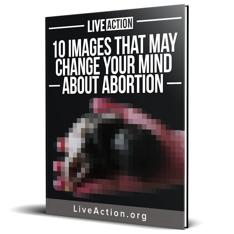 A black book with white text and a blurred out image