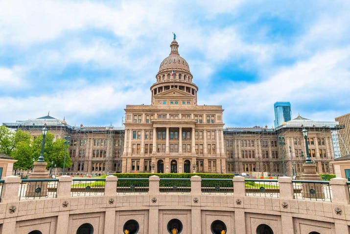 Scenic view of Texas State Capitol building and Capitol Extension Rotunda in Austin at sunny summer day