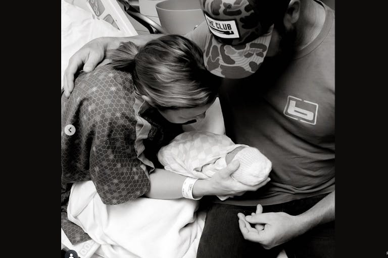 Screenshot: Drake White Instagram Country star Drake White and his wife, Alex, hold their daughter Della in the hospital.