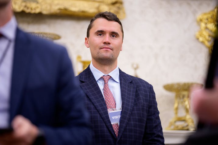 Photo by Andrew Harnik/Getty Images WASHINGTON, DC - MAY 28: Turning Point USA co-founder Charlie Kirk stands in the back of the room as U.S. President Donald Trump speaks during a swearing in ceremony for interim U.S. Attorney for Washington, D.C. Jeanine Pirro in the Oval Office of the White House on May 28, 2025 in Washington, DC. Trump has announced Pirro, a former Fox News personality, judge, prosecutor, and politician, after losing support in the Senate for his first choice, Ed Martin, over his views on the January 6, 2021 attack on the U.S. Capitol. (Photo by Andrew Harnik/Getty Images)