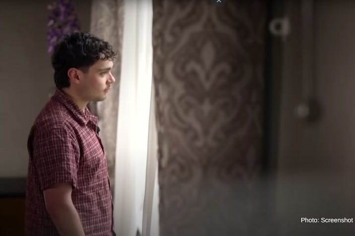 Screenshot: YouTube Channel 4 News man standing looking out of a window