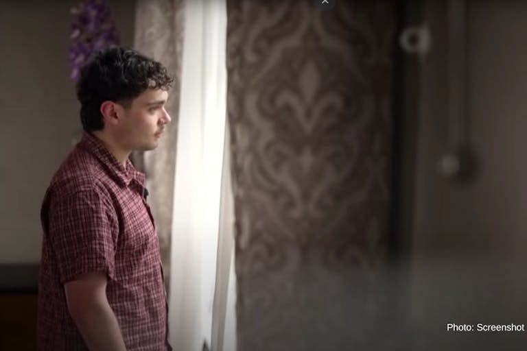 Screenshot: YouTube Channel 4 News man standing looking out of a window