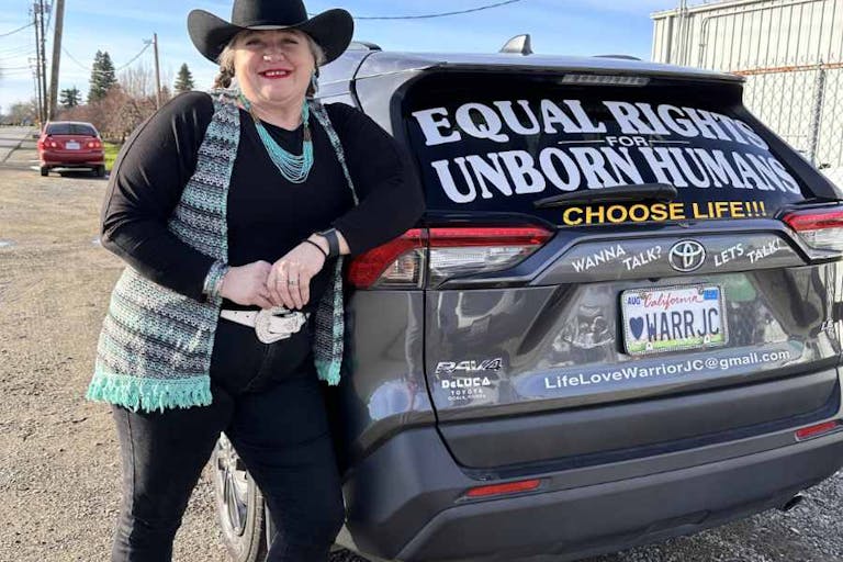 Photo courtesy of JC Carpenter JC Carpenter next to her pro-life car