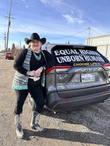 JC Carpenter next to her pro-life car