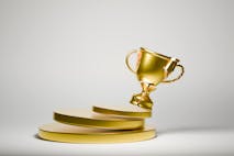 Image: Getty Images Broken trophy toppling over, Digitally Generated Image , 3D rendered