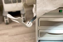 Photo: Getty Images medical examination table & close-up of stirrup