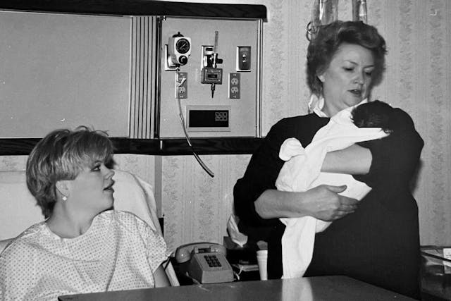 Kim watching her mother hold her daughter just after birth in hospital