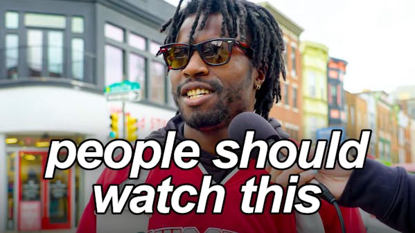 black man in red jacket and sunglasses, caption: people should watch this