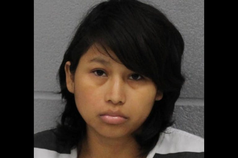 Neli Dinora Rivera Felipe; mugshot in black and white prison jumpsuit.