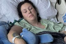 Photo credit: GoFundMe woman in hospital bed recovering from jumping out second story window