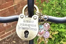 Padlock featuring writing that honors babies, lists Not Forgotten Ministries