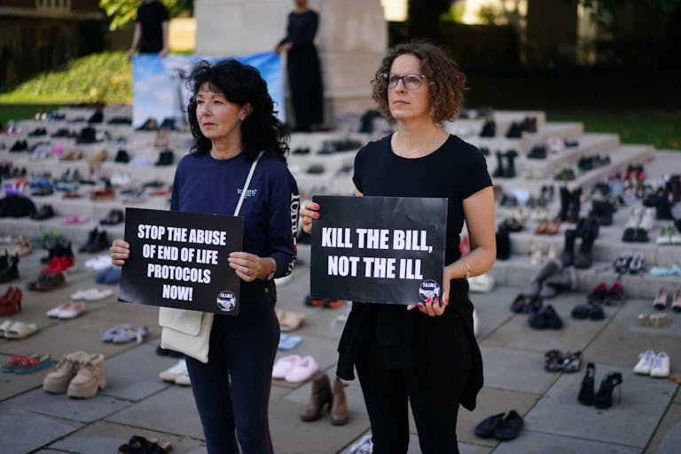 Campaigners in opposition of the Assisted Dying Bill, from Families Against Involuntary Medical Euthanasia (F.A.I.M.E), hold signs as the group stage a demonstration outside the Houses of Parliament, London, as the House of Lords is having its second day of the Second Reading debate for the Bill. Picture date: Friday September 19, 2025.