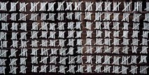 Counting stripes calendar. Handmade tally marks written on the wall by white chalk. Endless  pandemie lockdown, longtime prison, waiting for the summer, ancient counting methods concept.