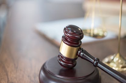 Justice scales and books and wooden gavel