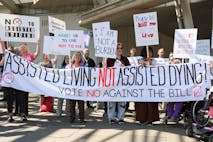 EDINBURGH, SCOTLAND - MAY 13: Opponents on the vote on the plans to legalise assisted dying demonstrate outside the Scottish Parliament to show support against Stage 1 of Scotland’s assisted dying bill on May 13, 2025 in Edinburgh, Scotland. MSPs are voting on whether or not to allow terminally ill adults to seek medical help to end their lives in the Scottish Parliament today.