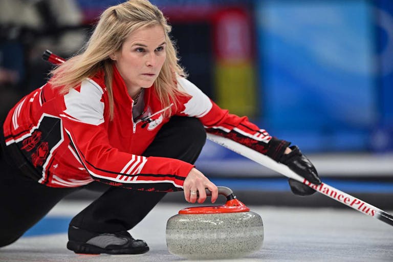 Canada's Jennifer Jones curls the stone during the women's round robin session 10 game of the Beijing 2022 Winter Olympic Games curling competition between Canada and USA at the National Aquatics Centre in Beijing on February 16, 2022.