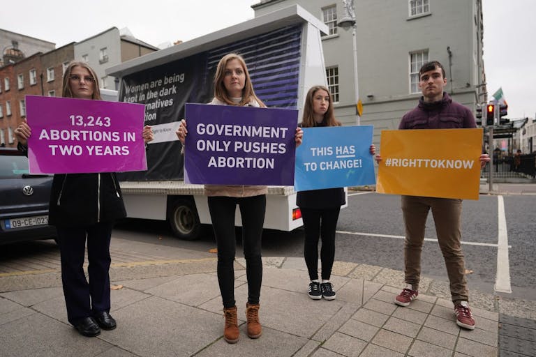 Photo by Niall Carson/PA Images via Getty Images L-R Kiley Jones, Eva Conroy, Brid Stritch and Peter Grenhan of the Pro Life Campaign taking part in an awareness event outside Leinster House in Dublin to launch a report, "Ireland's Abortion Law: End the Silence" which focuses on the Government's three year review of the abortion law. Picture date: Monday November 22, 2021.