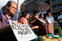 Women protests against Costa Rica's president, Carlos Alvarado, politics on abortion in San Jose, Costa Rica, on October 17, 2019. - Carlos Alvarado, President of Costa Rica, made a commitment to pass a regulation that will guarantee access to therapeutical abortion to those women whose health or life are at risk. A group of evangelical legislators and the Catholic Church of Costa Rica have been protesting against this decision and are pressing the president to not sign the regulation, as they consider it will open the door to abortion under any circumstance.