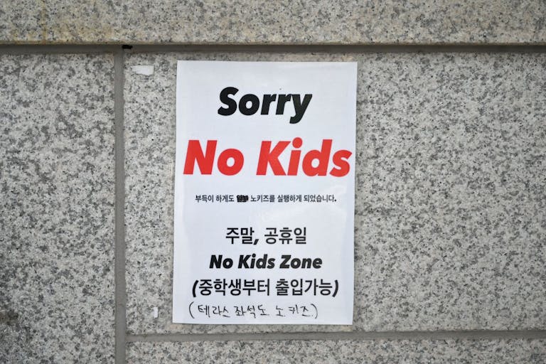 Photo by YELIM LEE/AFP via Getty Images This picture taken on July 20, 2023 shows a 'No Kids Zone' sign at the entrance to a cafe in Seoul. In a country with the world's lowest birth rate, the emergence of an increasing number of facilities barring children -- such as cafes, libraries and art galleries -- is infuriating parents like South Korean lawmaker Yong Hye-in and she says, inadvertently thwarting decades of government policy.