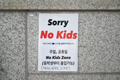 This picture taken on July 20, 2023 shows a 'No Kids Zone' sign at the entrance to a cafe in Seoul. In a country with the world's lowest birth rate, the emergence of an increasing number of facilities barring children -- such as cafes, libraries and art galleries -- is infuriating parents like South Korean lawmaker Yong Hye-in and she says, inadvertently thwarting decades of government policy.