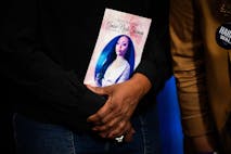 Shanette Williams, the mother of Amber Nicole Thurman, who ProPublica reported died in 2022 from a treatable infection due to delays to her medical care stemming from Georgia's restrictive abortion law, holds a photo of her daughter as she meets with US Vice President and Democratic presidential candidate Kamala Harris backstage, before Harris was due to speak during a campaign rally at Shell Energy Stadium in Houston, Texas, on October 25, 2024.