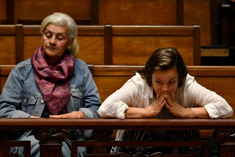 Photo by SANTIAGO MAZZAROVICH/AFP via Getty Images Women gesture as senators debate a euthanasia bill at the Legislative Palace in Montevideo on October 15, 2025. The Uruguayan Senate began voting to pass a controversial euthanasia bill into law. If approved, Uruguay will join a small group of countries that allow the procedure, including Canada, the Netherlands, New Zealand and Spain.