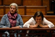 Women gesture as senators debate a euthanasia bill at the Legislative Palace in Montevideo on October 15, 2025. The Uruguayan Senate began voting to pass a controversial euthanasia bill into law. If approved, Uruguay will join a small group of countries that allow the procedure, including Canada, the Netherlands, New Zealand and Spain.