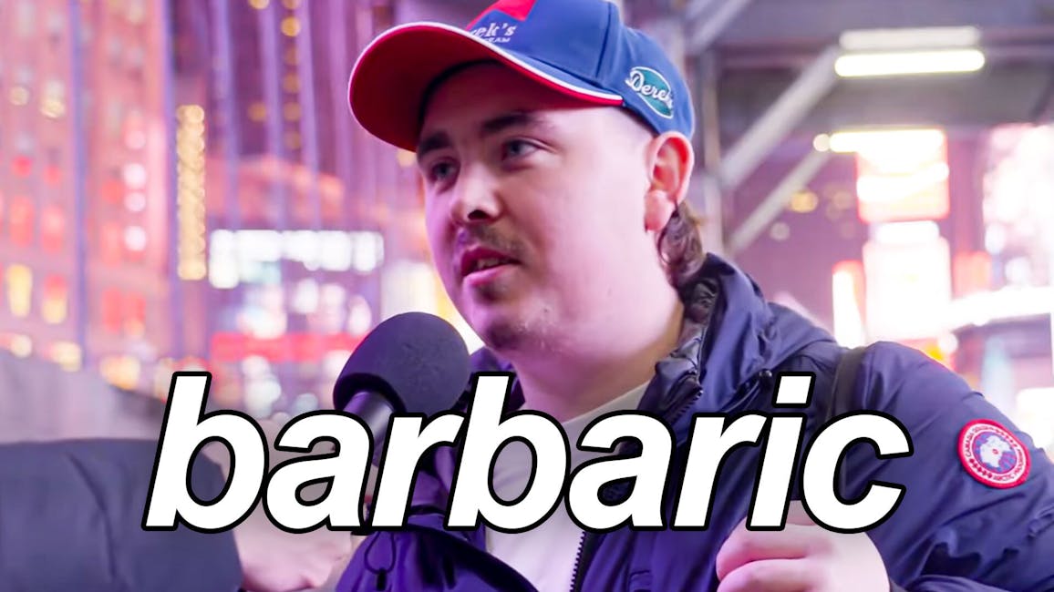 white man in blue jacket and baseball cap, caption: barbaric